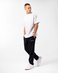 Russell Athletic Australia Men's Originals Big Arch Unbrushed Open Leg Track Pants - Black True Since 1902